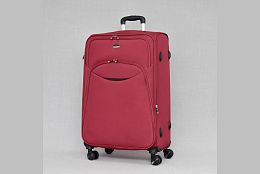 Голям текстилен куфар с четири колела в бордо